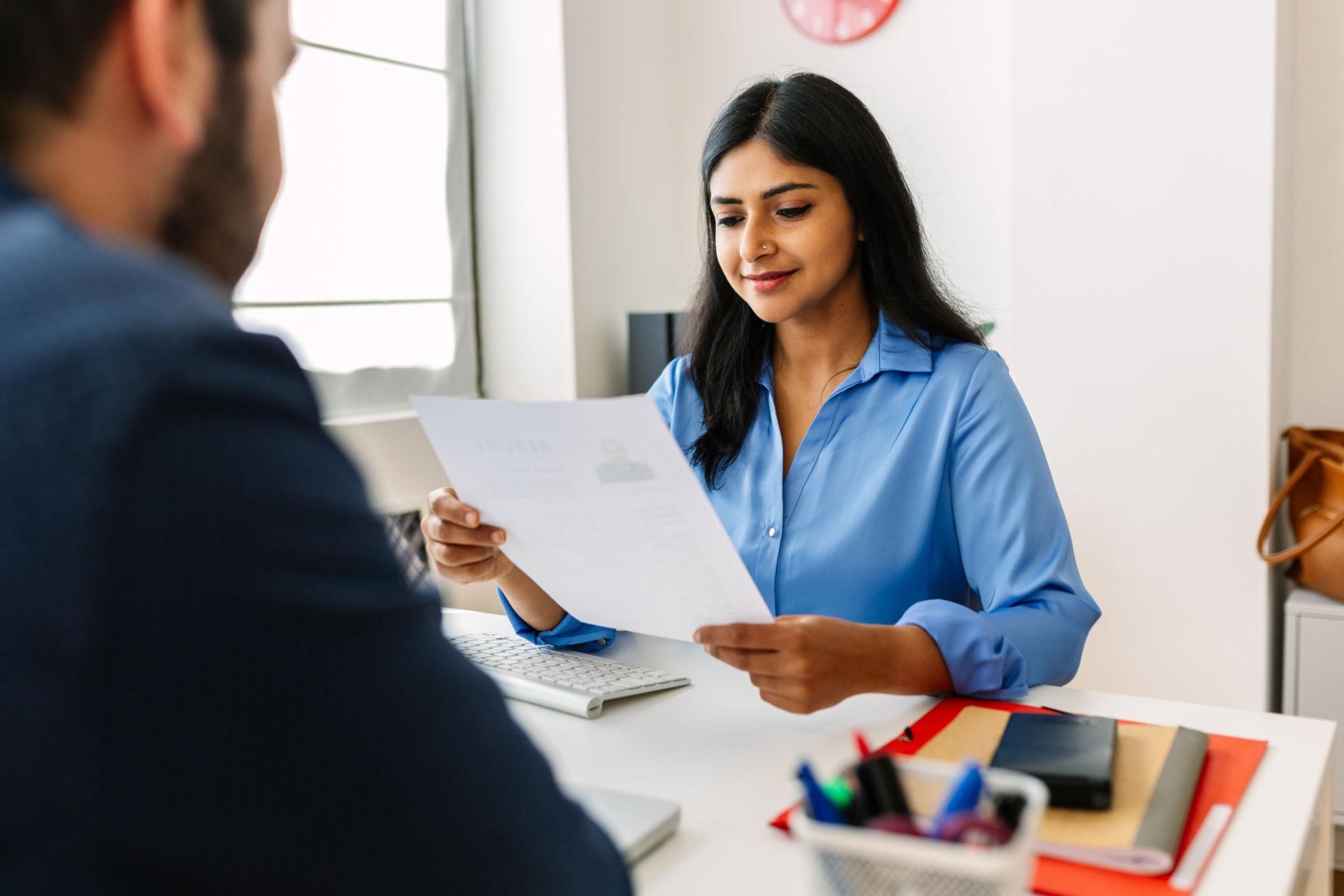 Recruiter reading a well-written professional summary